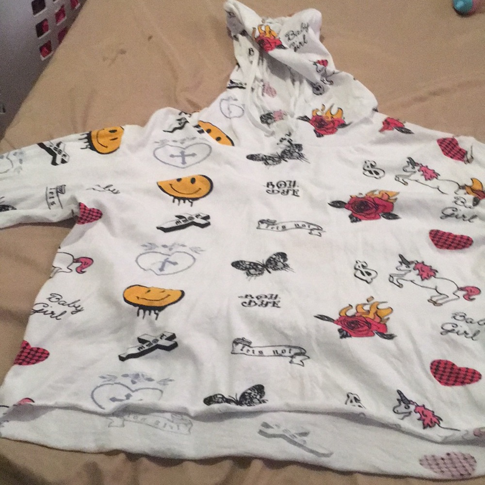 A white crop top with a horror long sleeve